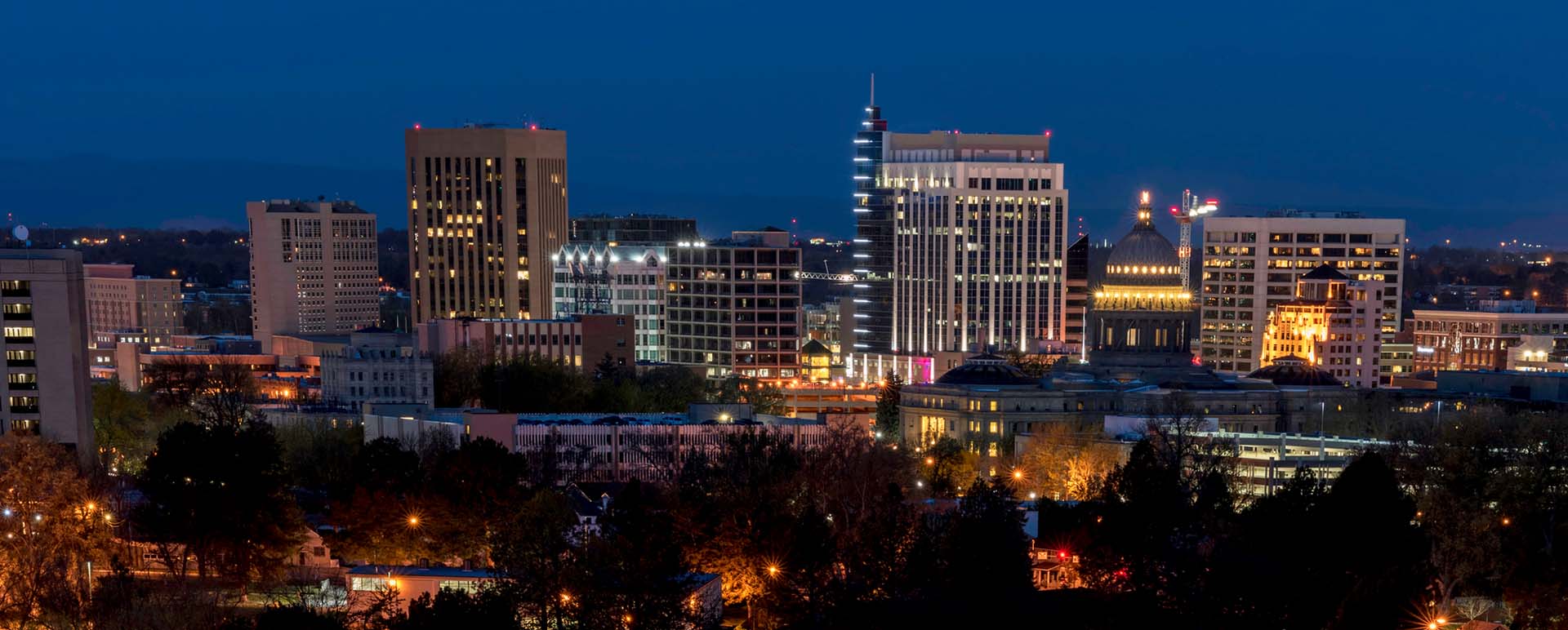 Neon color image of a band playing and people singing along